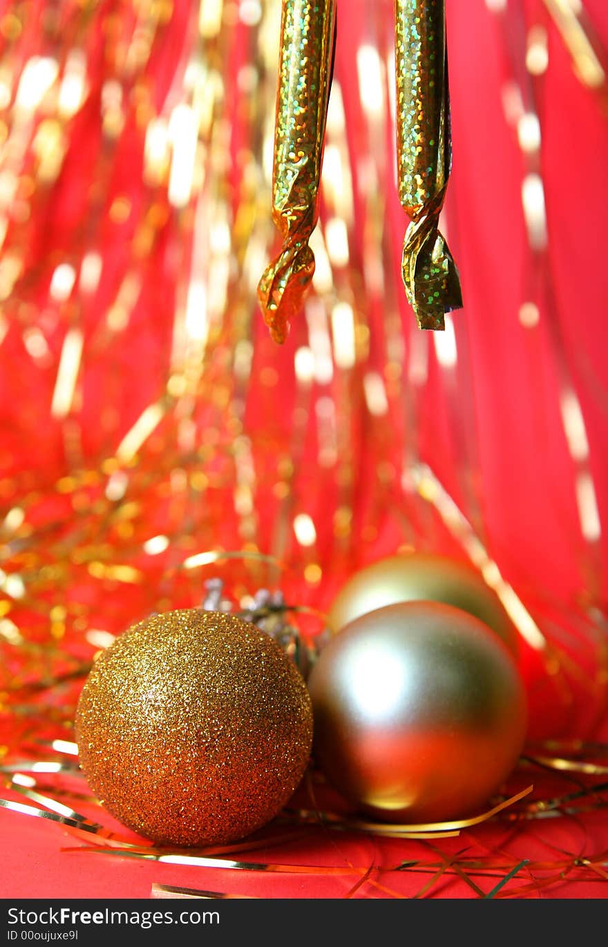 Christmas ornament, gold balls and red background