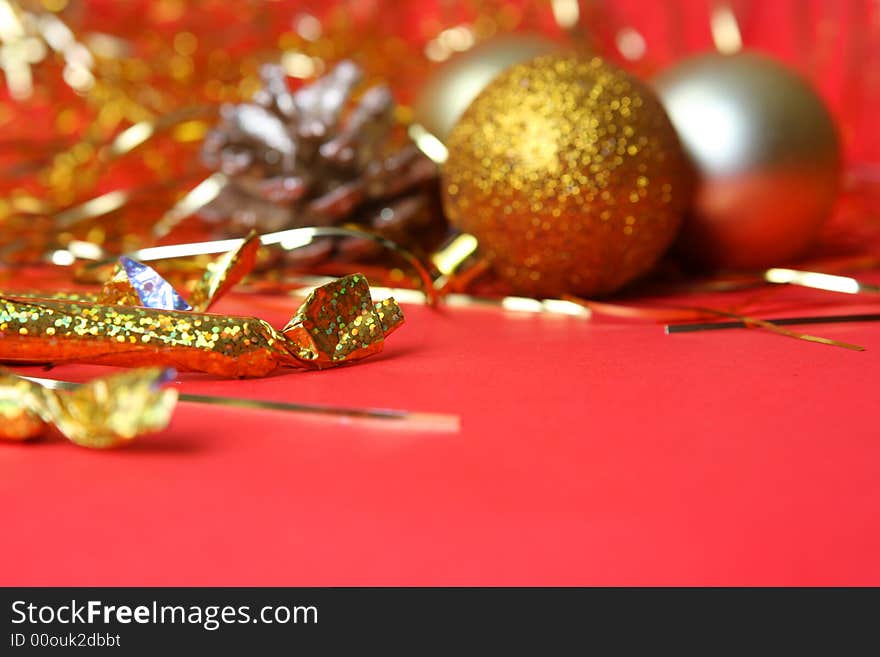 Christmas ornament, gold balls and red background