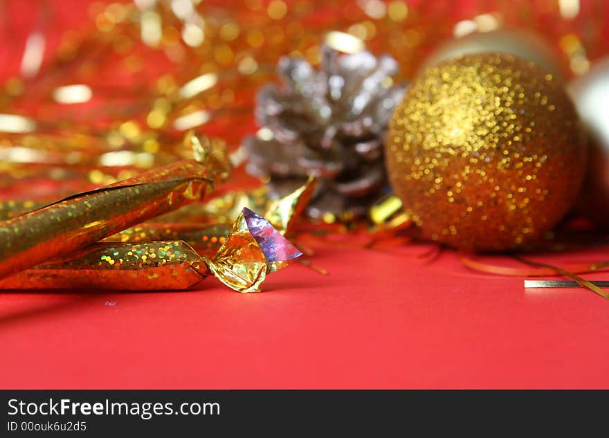 Christmas ornament, gold balls and red background