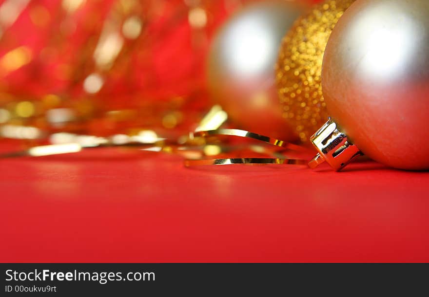 Christmas ornament, gold balls and red background