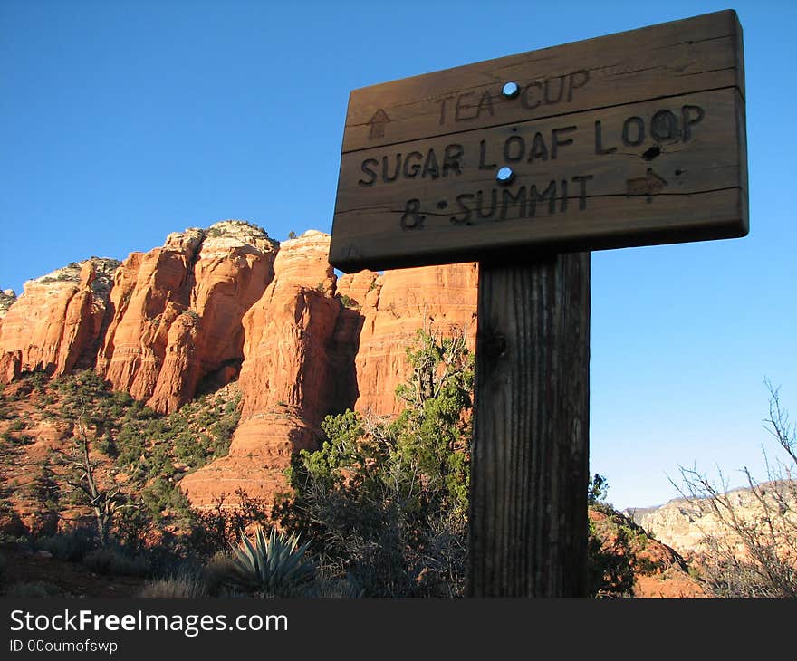 Trail sign in sedona's red rock forest. Trail sign in sedona's red rock forest.