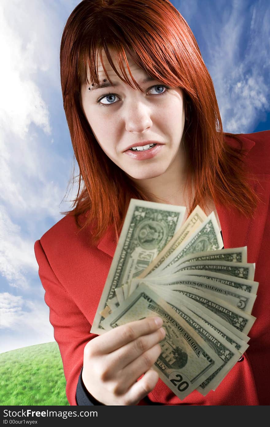 Surprised girl waving American dollars