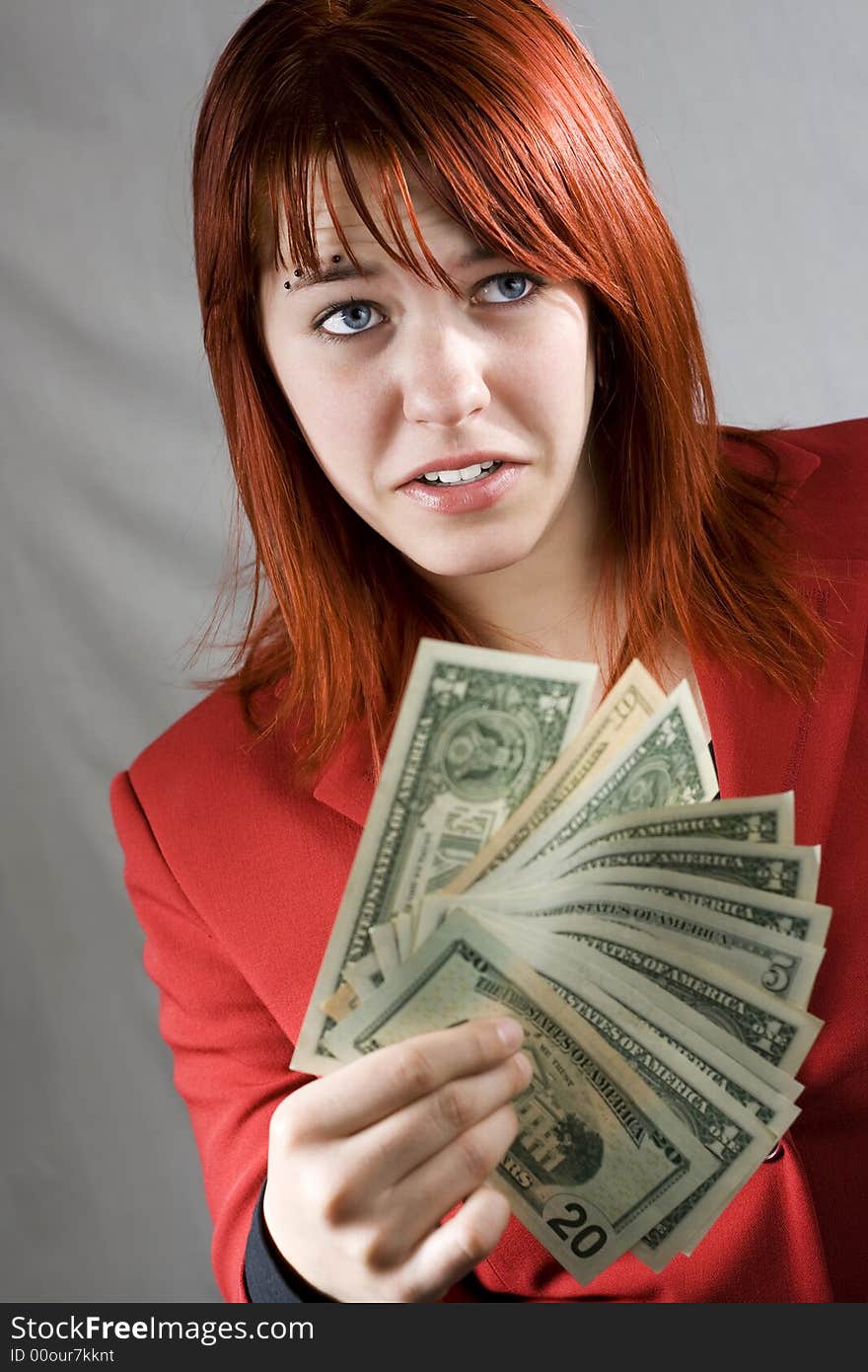 Surprised girl waving American banknotes, dollars.

Studio shot. Surprised girl waving American banknotes, dollars.

Studio shot.