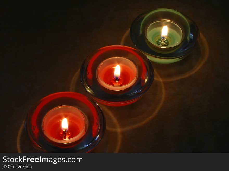 Three candles over a tablecloth