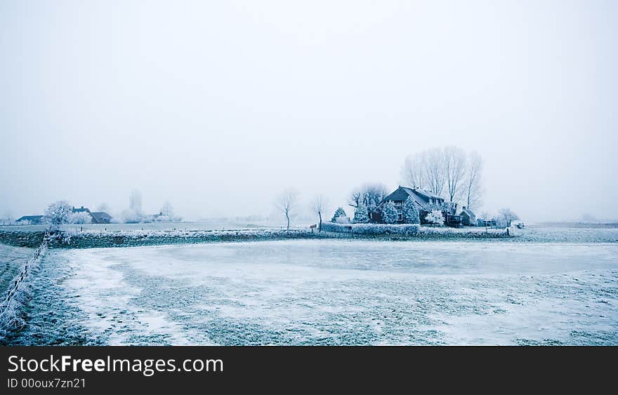 Farm house in the middle of winter surrounded by frozen trees and ice. Farm house in the middle of winter surrounded by frozen trees and ice