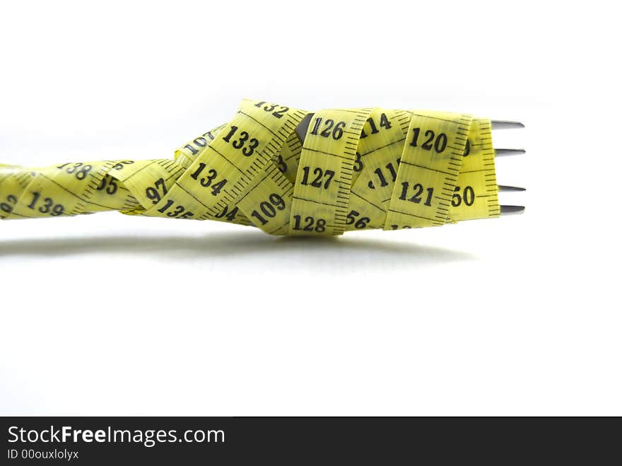 Close-up of an fork  with a measuring tape around it
 Great diet concept. Close-up of an fork  with a measuring tape around it
 Great diet concept.