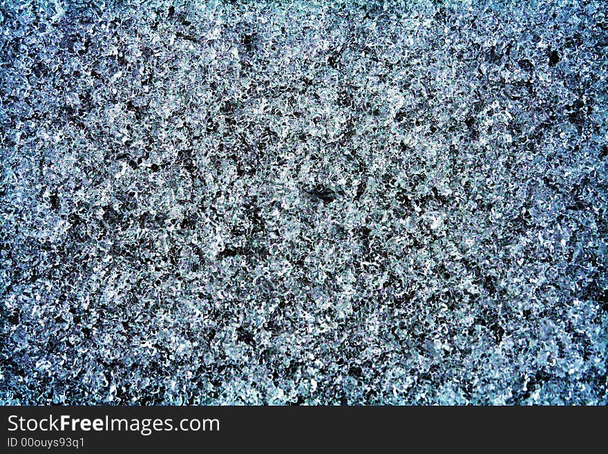 Close-up of melting snow with a filter applied to bring out extra color.