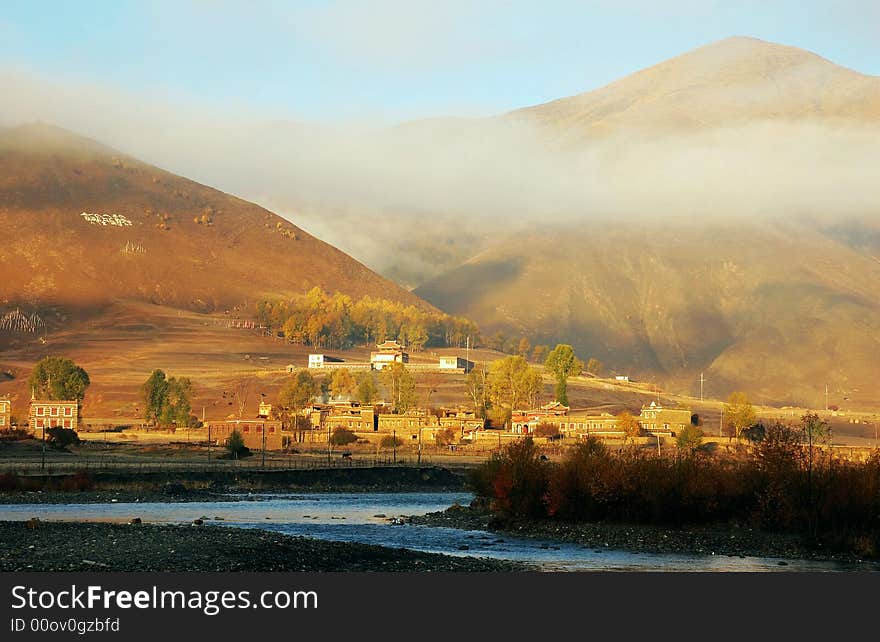 A foggy valley with a river