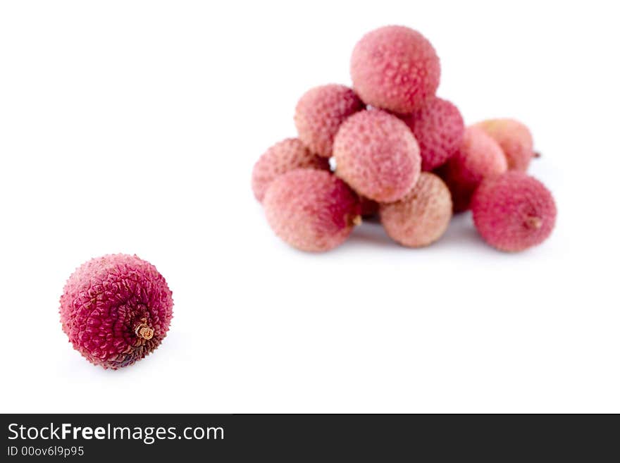 Healthy ripe pink litchies with course prickly peel. Healthy ripe pink litchies with course prickly peel