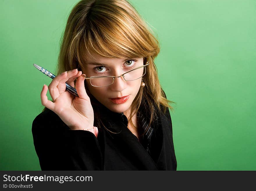 Studio portrait of a beautiful red head girl on green background. Studio portrait of a beautiful red head girl on green background