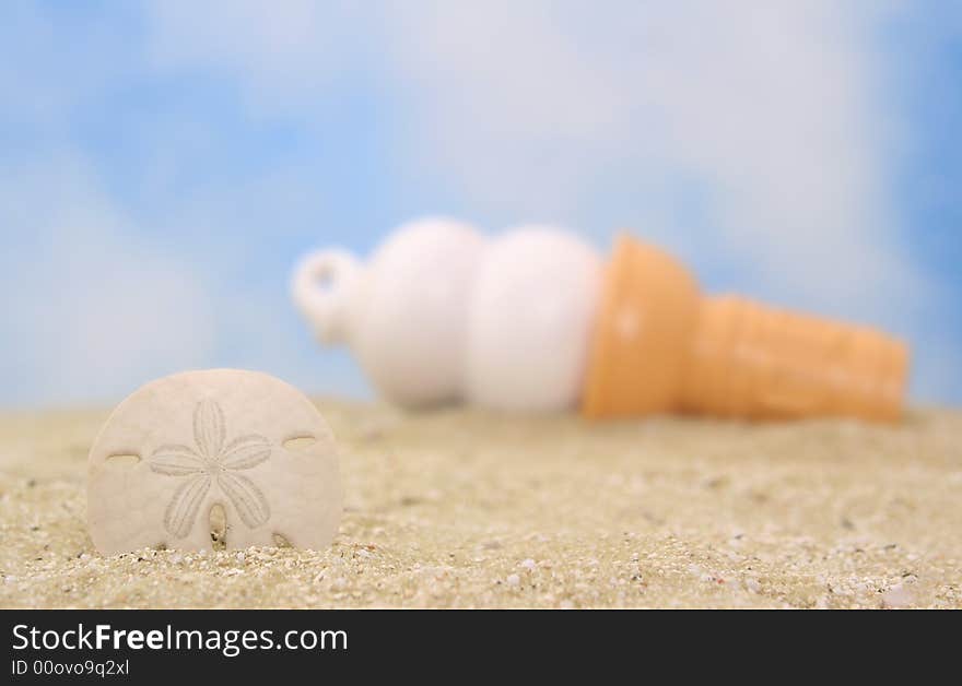 Sea Shell and Ice Cream Cone on Beach, Shallow DOf