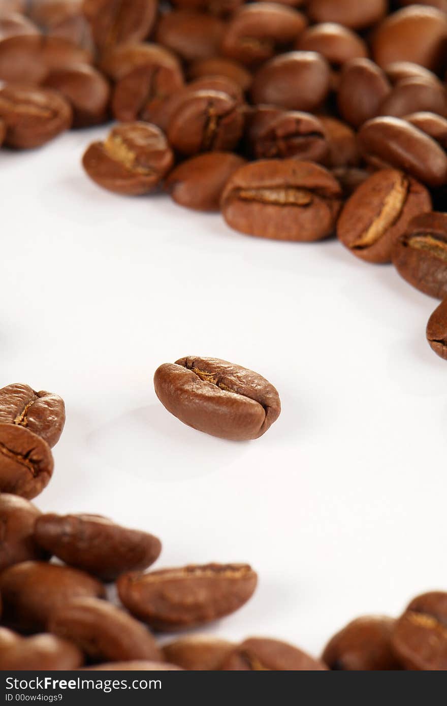 Grains of coffee on a white background