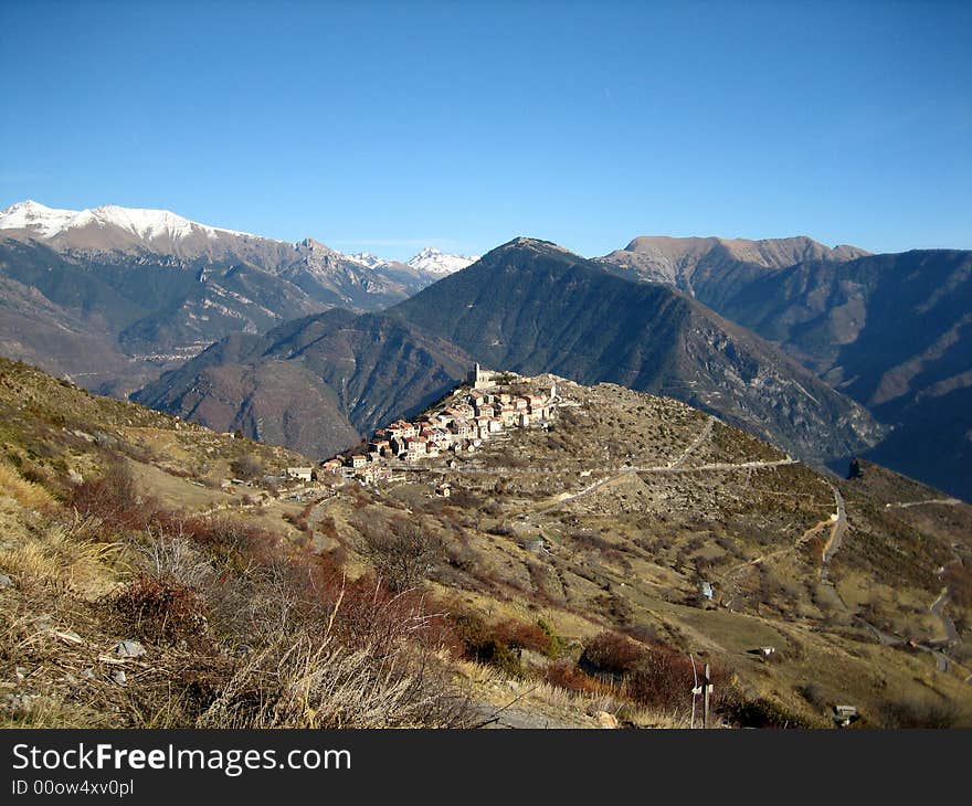 Panoramic view over the surrounding mountains and Illonse, an antique village of the Alpes-Maritimes in France. Panoramic view over the surrounding mountains and Illonse, an antique village of the Alpes-Maritimes in France.