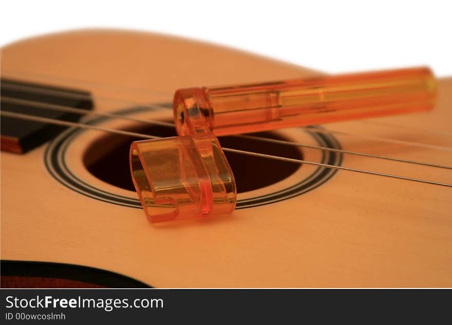 Ukulele a-small acoustic guitar. It is isolated on a white background