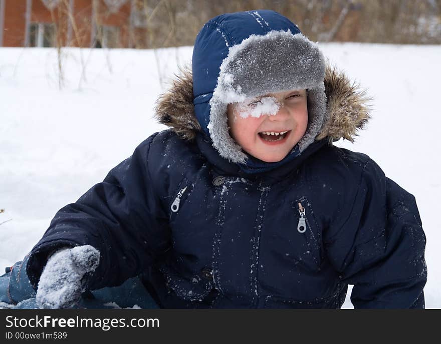 Little boy play winter day. Little boy play winter day