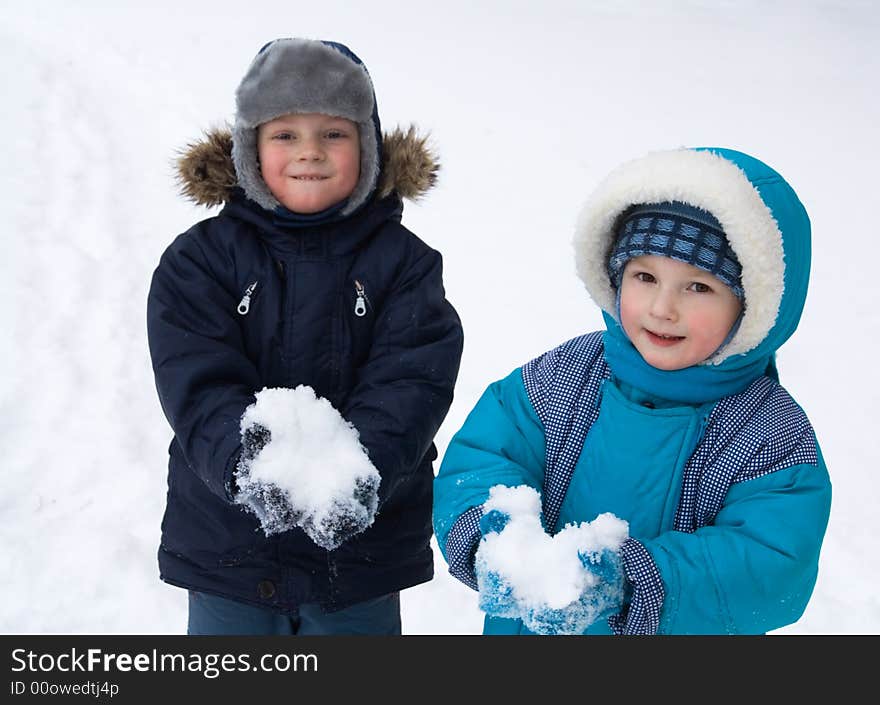 Little boys play winter day. Little boys play winter day