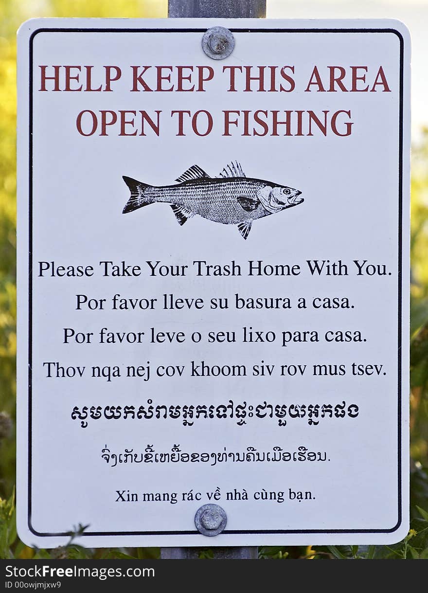 Multilingual warning sign at Sachuest point National Wildlife Refuge in Middletown, RI, USA. Multilingual warning sign at Sachuest point National Wildlife Refuge in Middletown, RI, USA