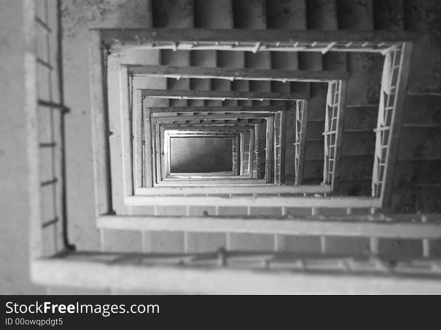 Looking down a staircase with railings. Looking down a staircase with railings....