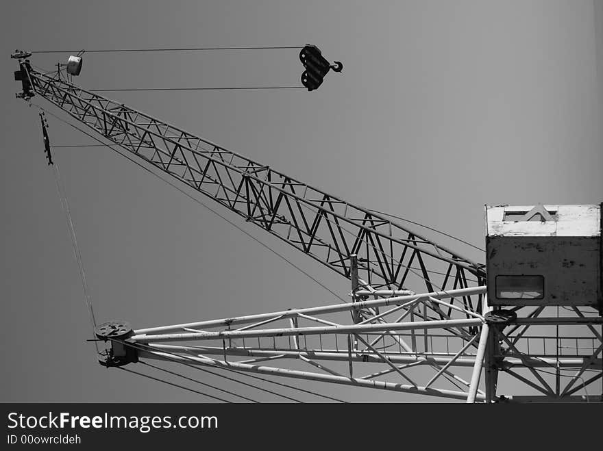 Old crane with its hook and cables. Old crane with its hook and cables