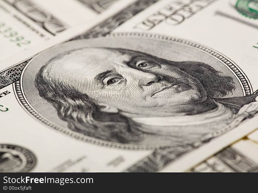 Benjamin Franklin close-up from a $100 bank note. Lens focused on Benjamin Franklin right eye. Benjamin Franklin close-up from a $100 bank note. Lens focused on Benjamin Franklin right eye.