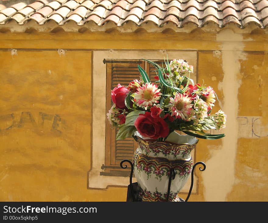 A flowerpot in an old French village. A flowerpot in an old French village