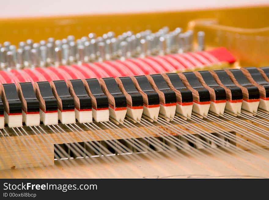 Inside a baby grand piano. Inside a baby grand piano.