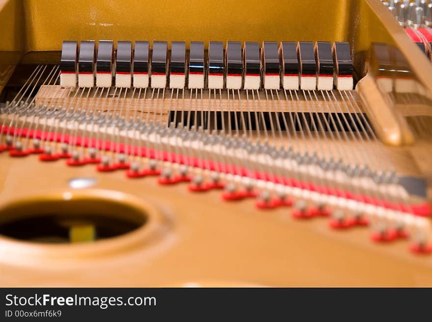 Inside a baby grand piano. Inside a baby grand piano.