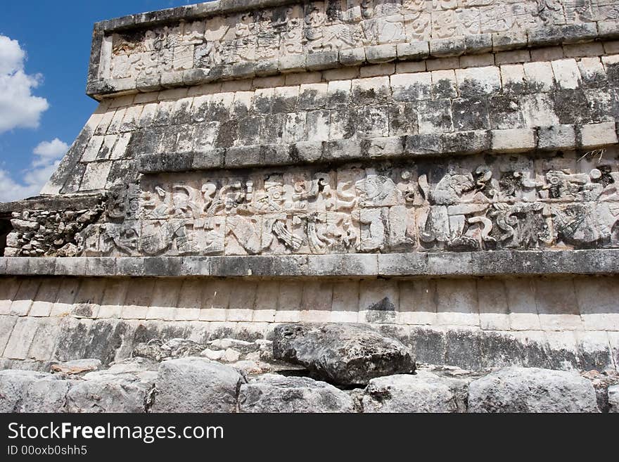 Mayan figures carved into the old stone wall at Chichen Itza. Mexico. Mayan figures carved into the old stone wall at Chichen Itza. Mexico