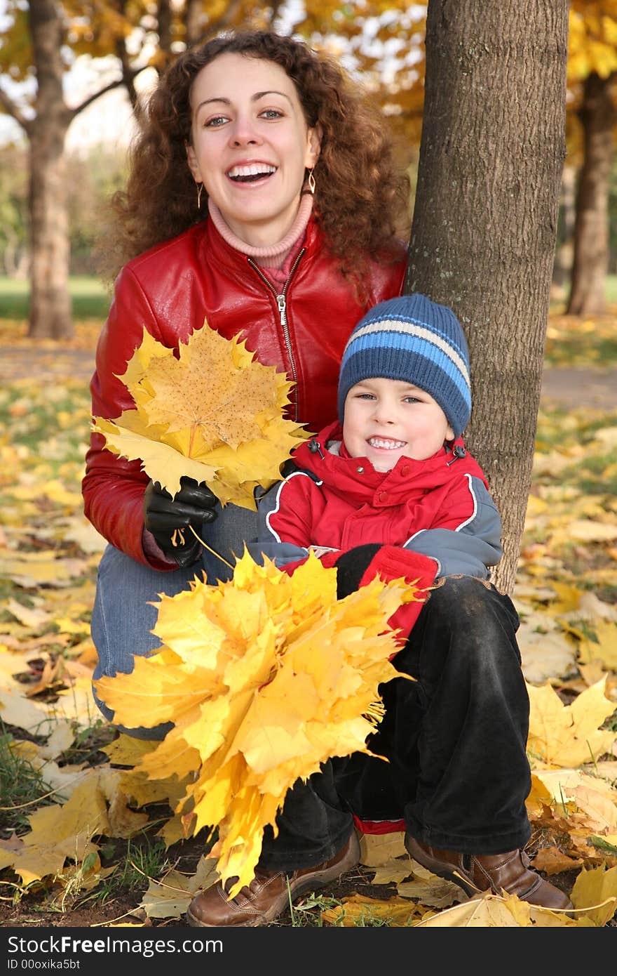 Mother with son in the park in autumn