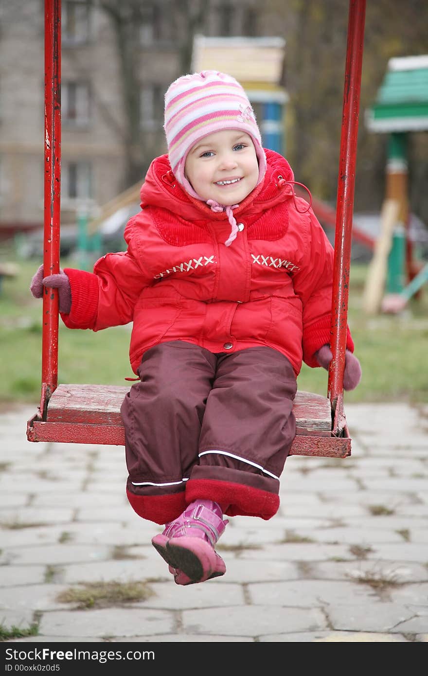 The portrait of girl on the swings