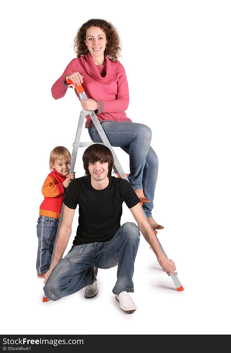 Family on the stepladder on the the white