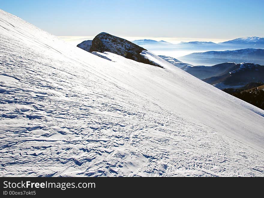 Amazing vie of mountains after snowfall - very steep slope. Amazing vie of mountains after snowfall - very steep slope