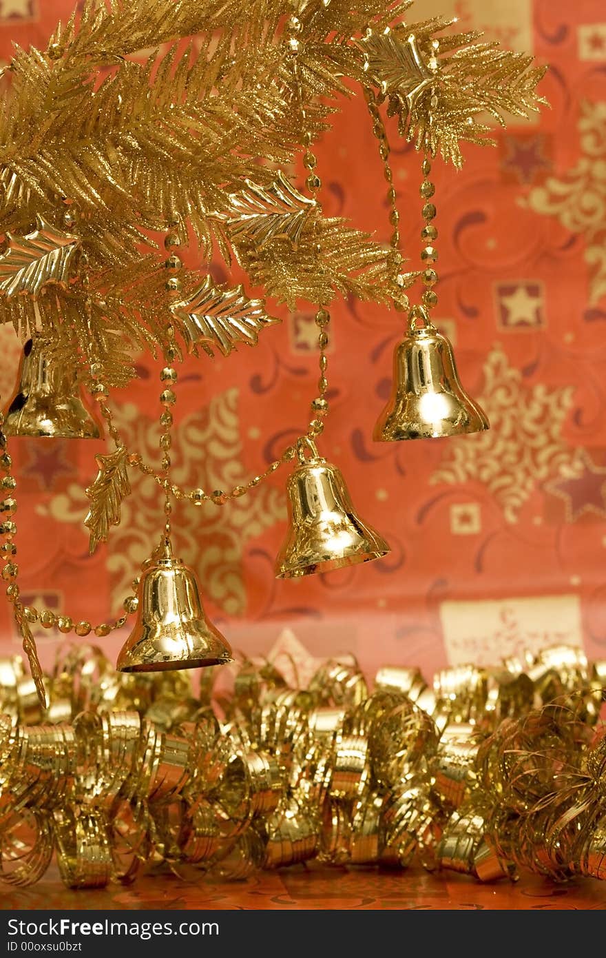 New-year handbells and Christmas tree on red background