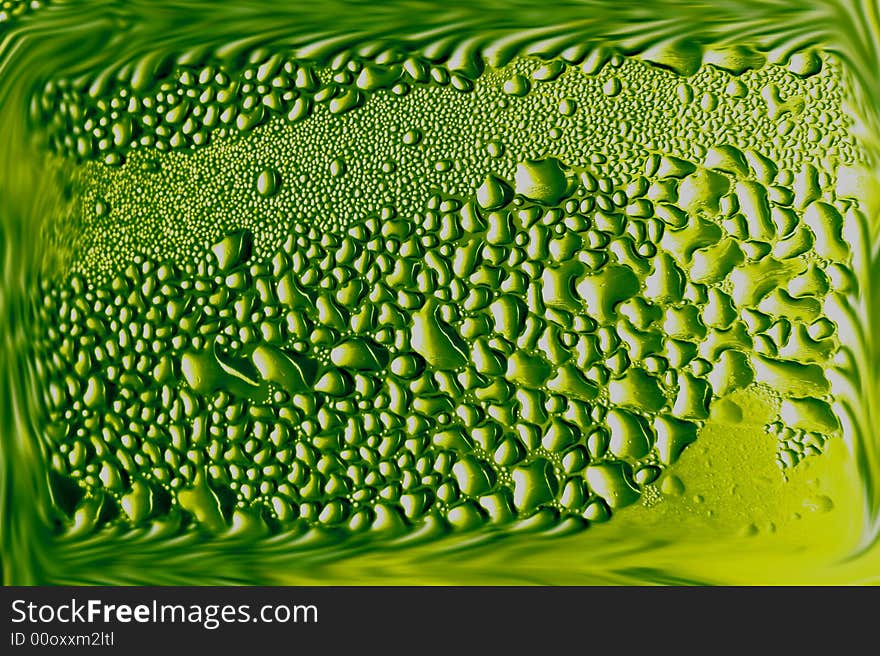 Drop of water on a green background