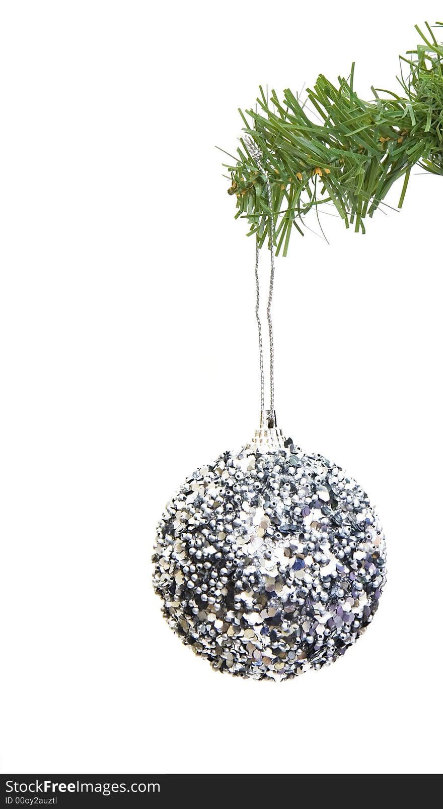 Grungy ornament hanging on a christmas tree