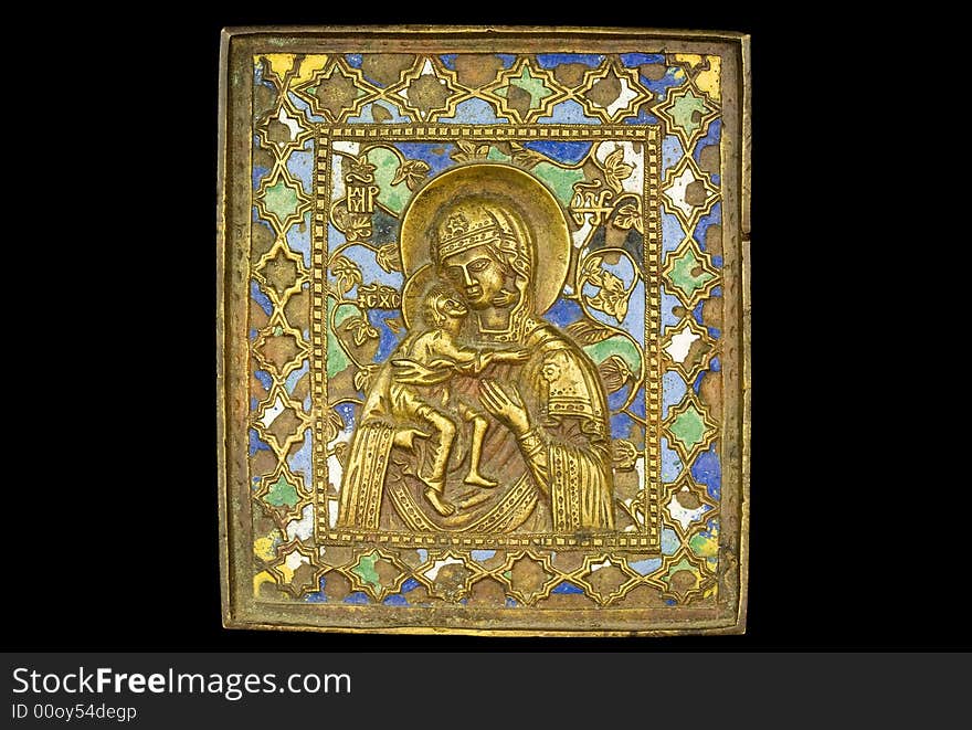 An ancient madonna metallic icon. An ancient madonna metallic icon