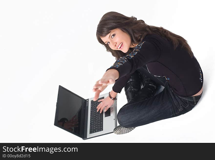 Young brunette girl in black with lap top computer representing modern communications. Young brunette girl in black with lap top computer representing modern communications.