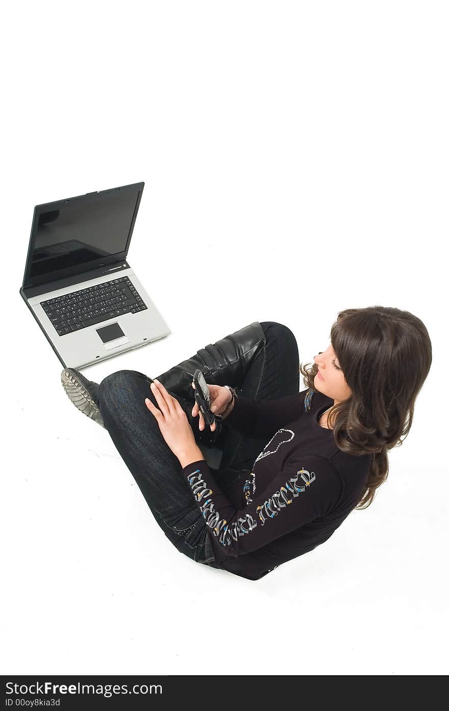 Young brunette girl in black with lap top computer representing modern communications. Young brunette girl in black with lap top computer representing modern communications.