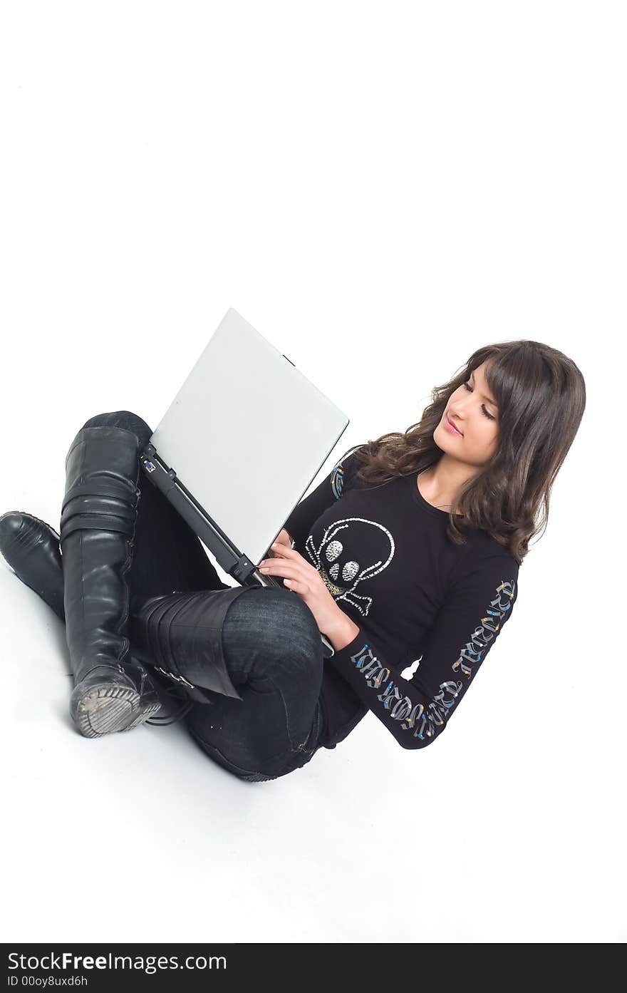 Young brunette girl in black with lap top computer representing modern communications. Young brunette girl in black with lap top computer representing modern communications.