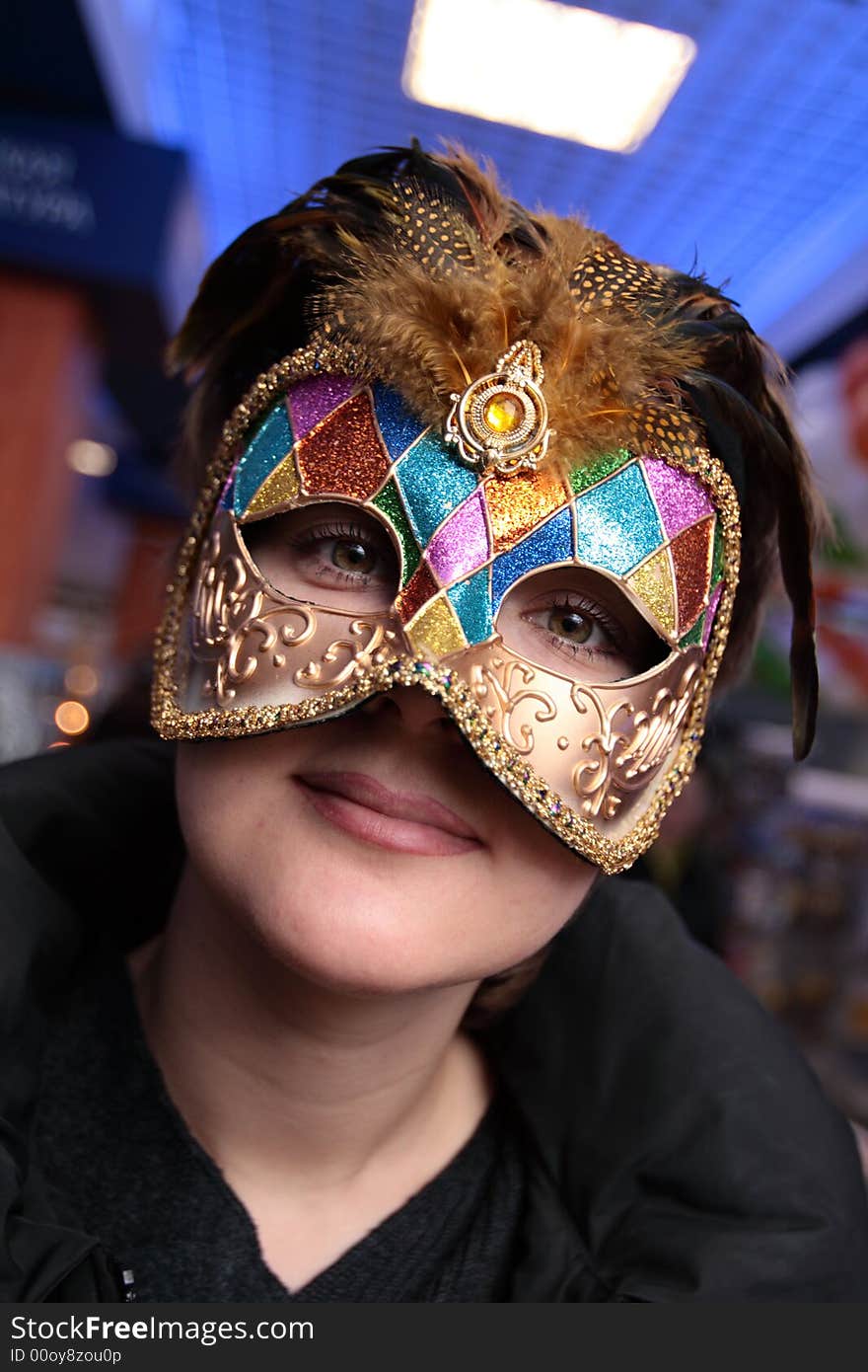 The green-eyed girl in the carnival mask. The green-eyed girl in the carnival mask