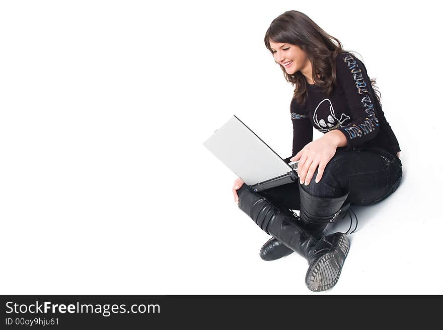 Young brunette girl in black with lap top computer representing modern communications. Young brunette girl in black with lap top computer representing modern communications.