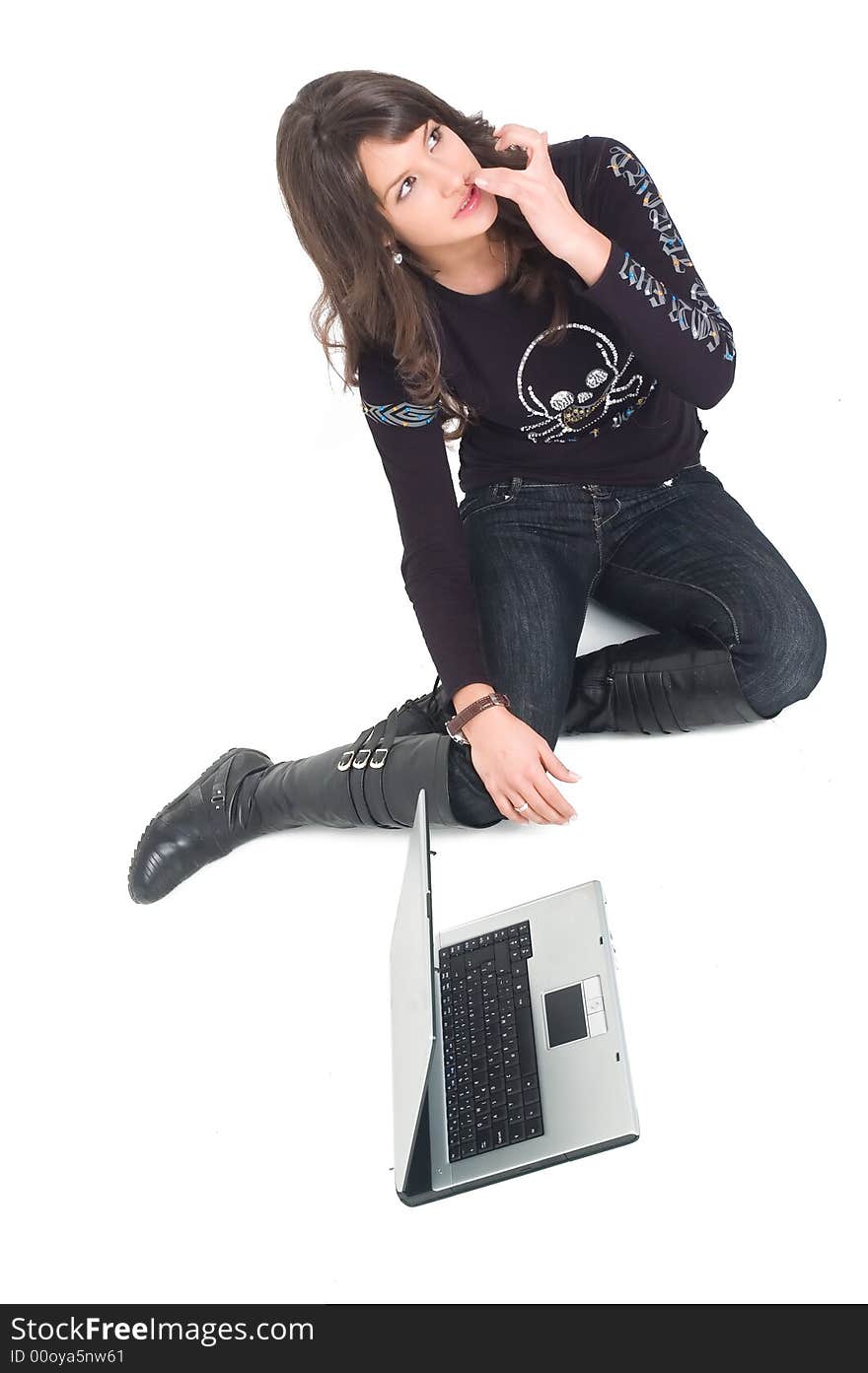 Young brunette girl in black with lap top computer representing modern communications. Young brunette girl in black with lap top computer representing modern communications.