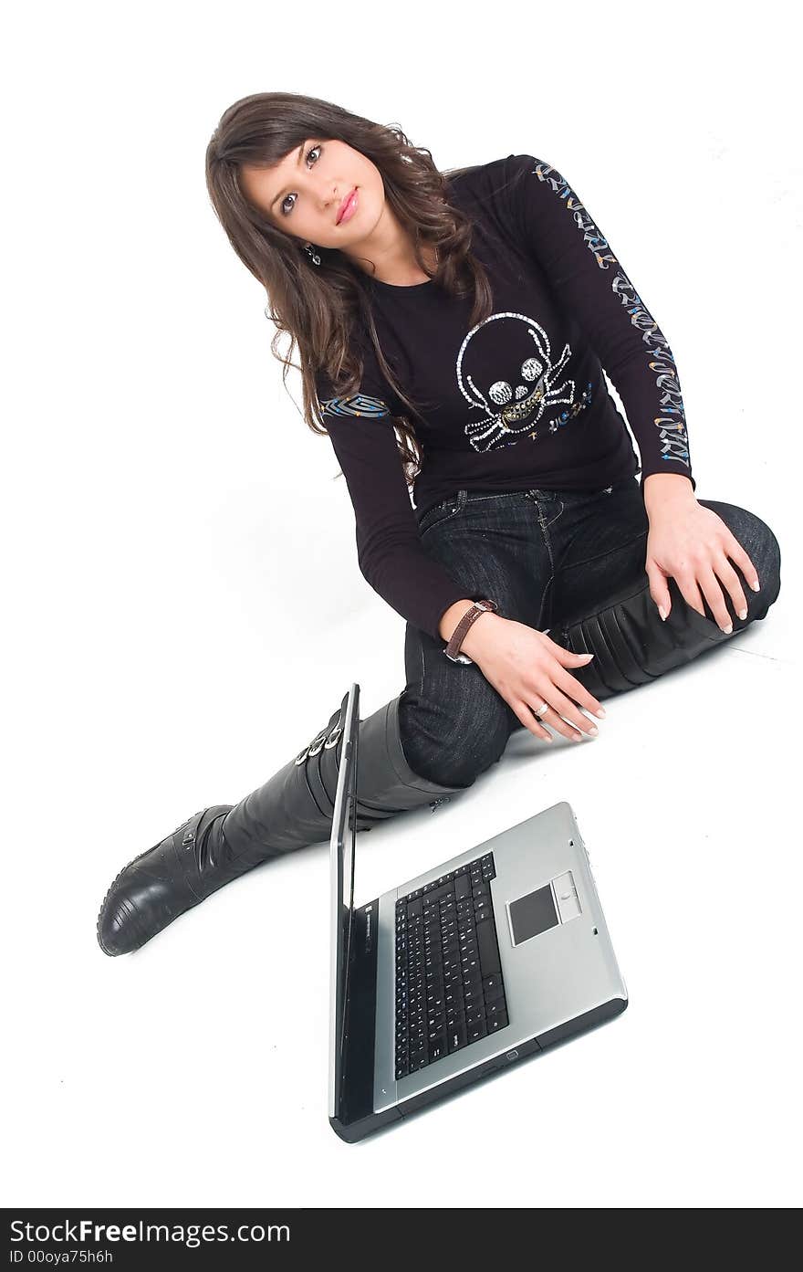 Young brunette girl in black with lap top computer representing modern communications. Young brunette girl in black with lap top computer representing modern communications.