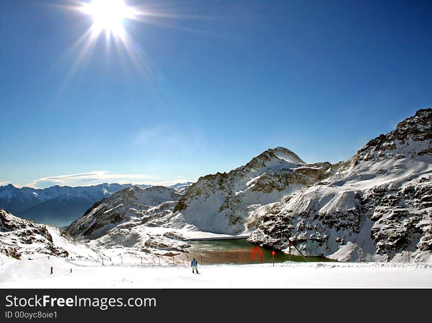 View on wide ski trail in alps. View on wide ski trail in alps