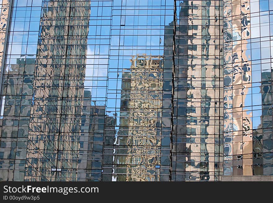 Skyscrapers reflected in another tall glass building in Boston, Massachusetts.