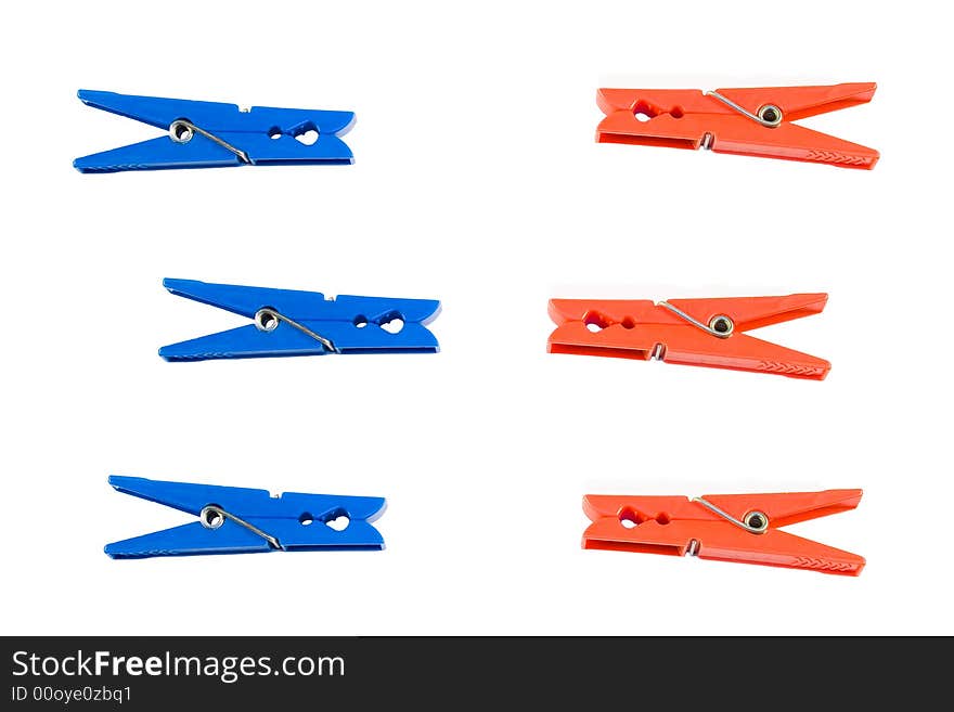 Red and blue clothes peg isolated on white background