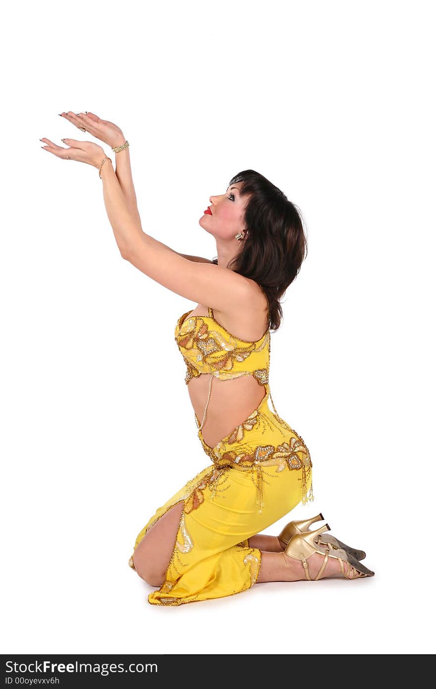 Yellow bellydancer on knees on white