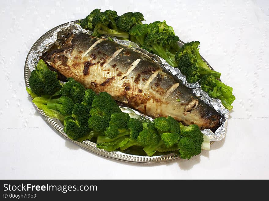 Baked pink salmon served with broccoli. Baked pink salmon served with broccoli