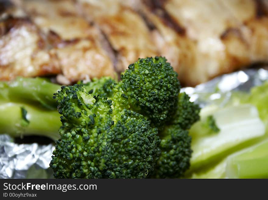 Close-up of baked pink salmon served with broccoli. Close-up of baked pink salmon served with broccoli