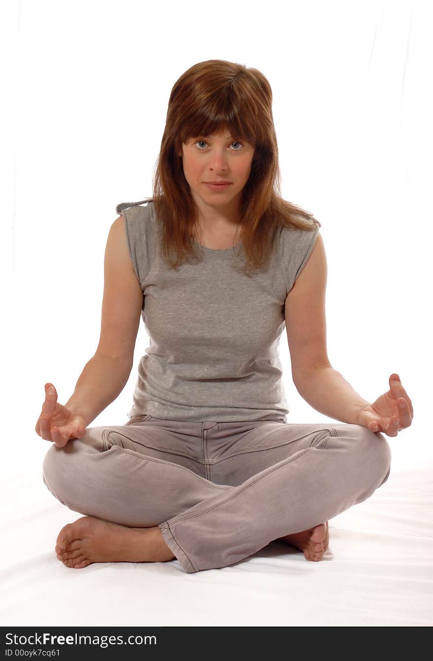 Cute young lady meditating